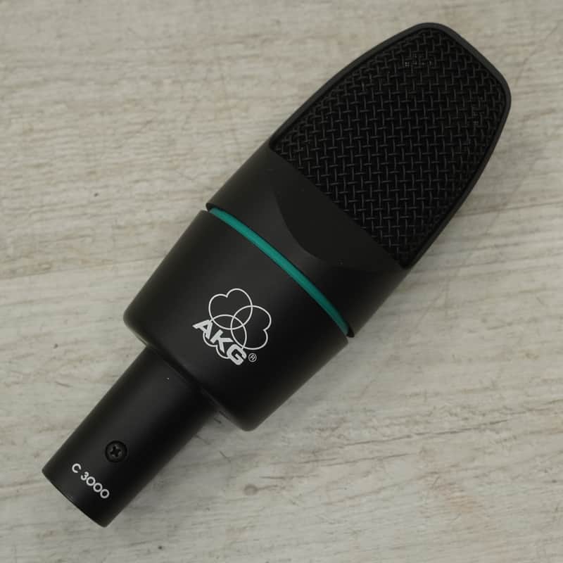 Two black microphones in open black carrying case with foam inserts.
