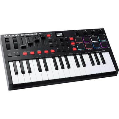 M-Audio OXYGENPROMINI Clavier-maître USB/MIDI 32 mini touches, 8 pads, 4 potentiomètres, 4 faders