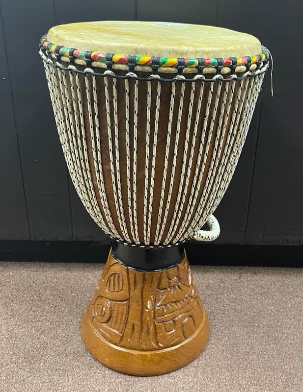Djembe carved hand drum 12" (small tear in head) image 1