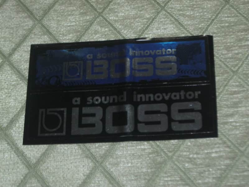 never used genuine BOSS sticker sheet (1 sheet has 2 stickers) 1) BOSS a sound innovator - colors Silver, Blue, Black Silver & 2) BOSS a sound innovator - colors Silver & Black (specifically from 1988), was orig paired w/ a DC3 Japan (pedal NOT included) image 1