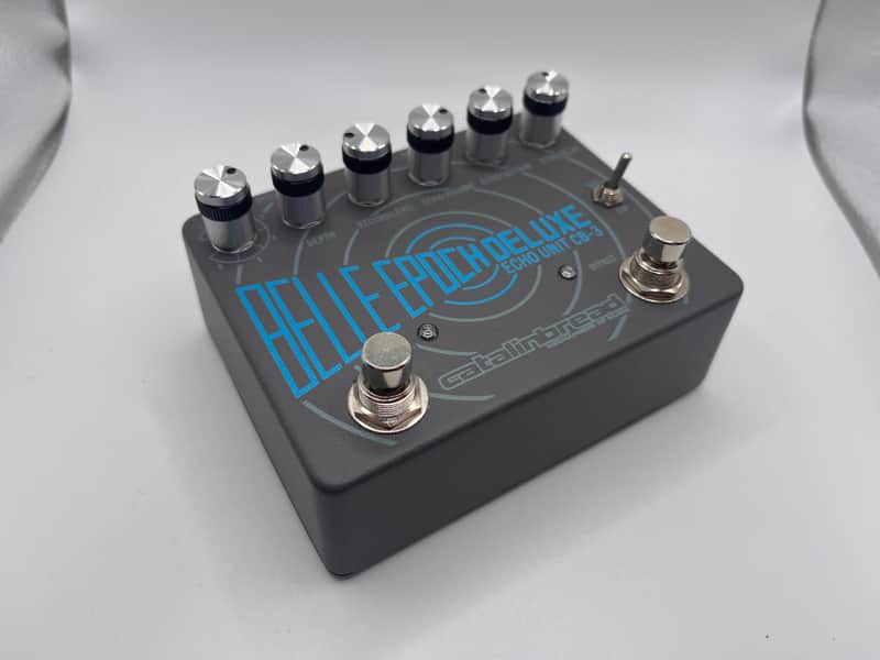 Grey electronic echo unit with knobs and "BELLE EPOCH DELUXE" text.