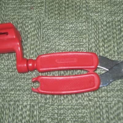new old stock open package A+ D'Addario / Planet Waves 1st ver Pro-Winder RED String Winder & Cutter & Bridge PIn Puller, has different handle design than current DP0002 model,  from 2000s - for guitars, banjos, ukuleles, and mandolins image 6