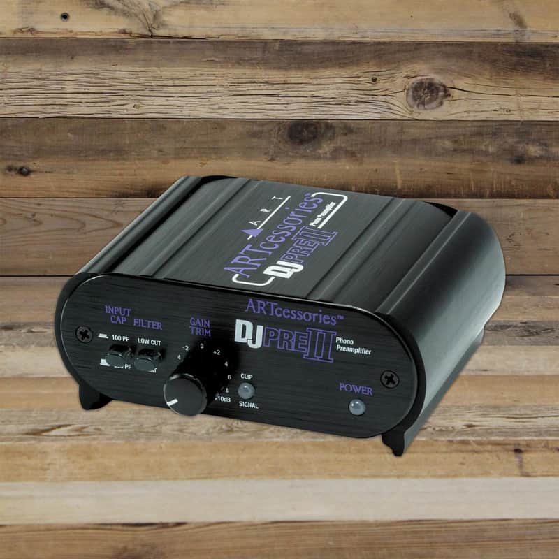 Black DJ preamplifier with silver knobs and visible input/power controls.