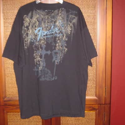 new old stock genuine Fender Heaven's Gate Custom Shop 100% Cotton Black Short Sleeve T-Shirt, XXL (XX-Large) (part #): 9101040806, early 2010s, GRAPHIC: Tan, Blue, Brown, Black (cross, 2 guitars, floral swirl, Fender, Custom Shop) NO: hang tag/packaging image 1