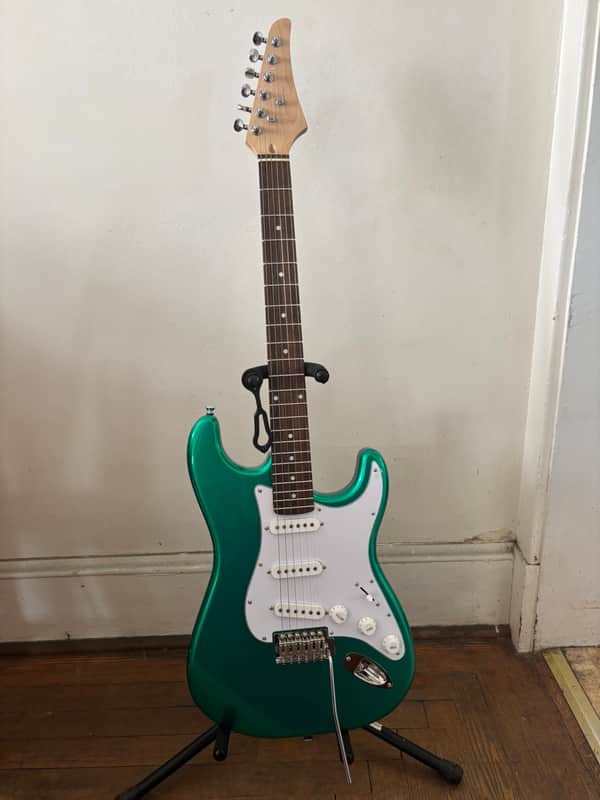 Custom Built 2026 guitar, Mahogany Body, Maple neck with laurel fingerboard. Metallic green body. Pro setup done play's great. Upgraded locking tuners, Matching Bridge image 1