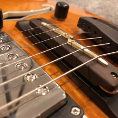 O. C. Guitars ebony wood bridge with brass saddles. equator and many other hollow bodies. image 2