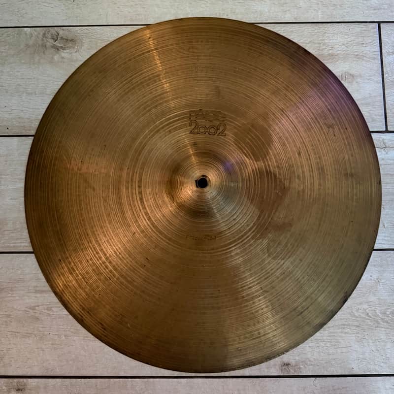 Four bronze cymbal discs in clear plastic packaging, labeled "CRASH" and "SPLASH.