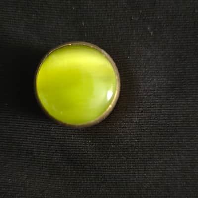 Gold and yellow tone knob with screw image 1