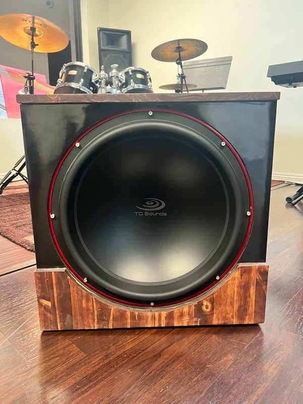 Exquisite TC Sounds LMS Ultra 5400 18" Subwoofer - Pristine Condition, sleek black satin, striking red trim, and luxurious wood grain base. image 1