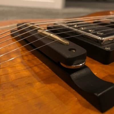 O. C. Guitars ebony wood bridge with brass saddles. equator and many other hollow bodies. image 1