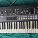 Akai AX60 Analog Synthesizer + Tauntek OS Kit + Soft Case + Sampler Cable | 1986 | Vintage