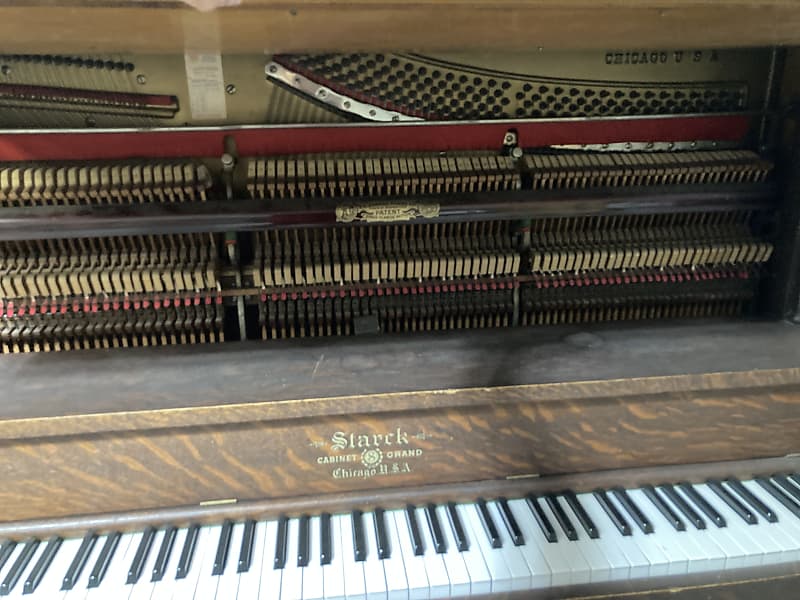 Starck cabinet store grand piano