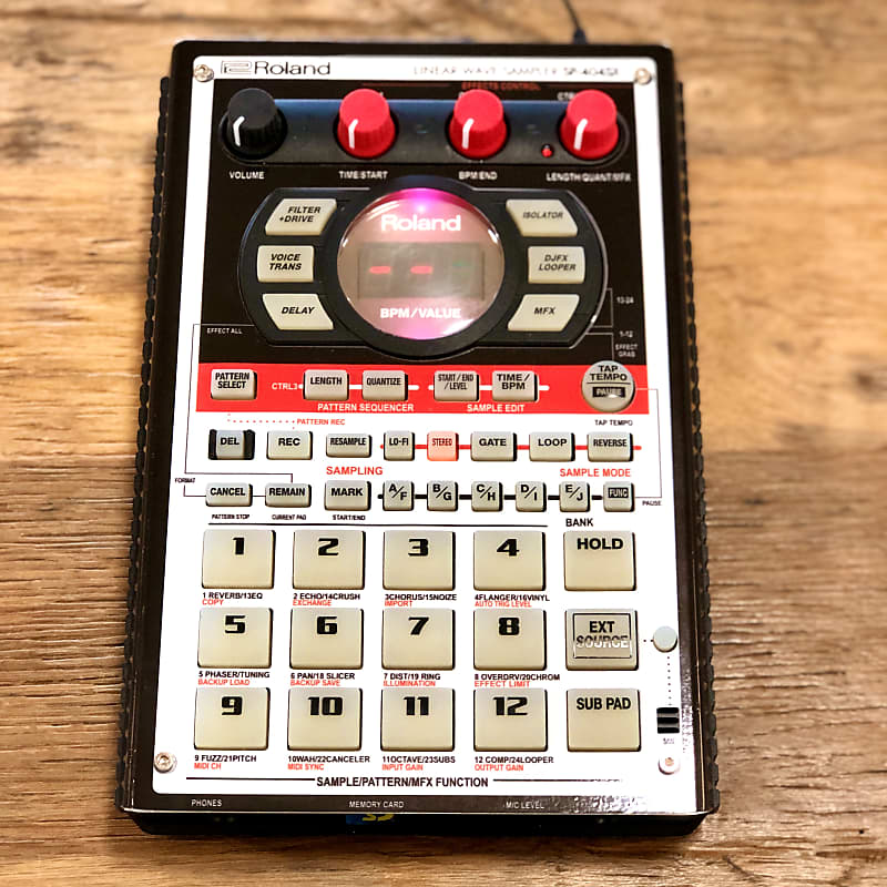 Roland SP-404SX with 303 vinyl skin and fat knobs