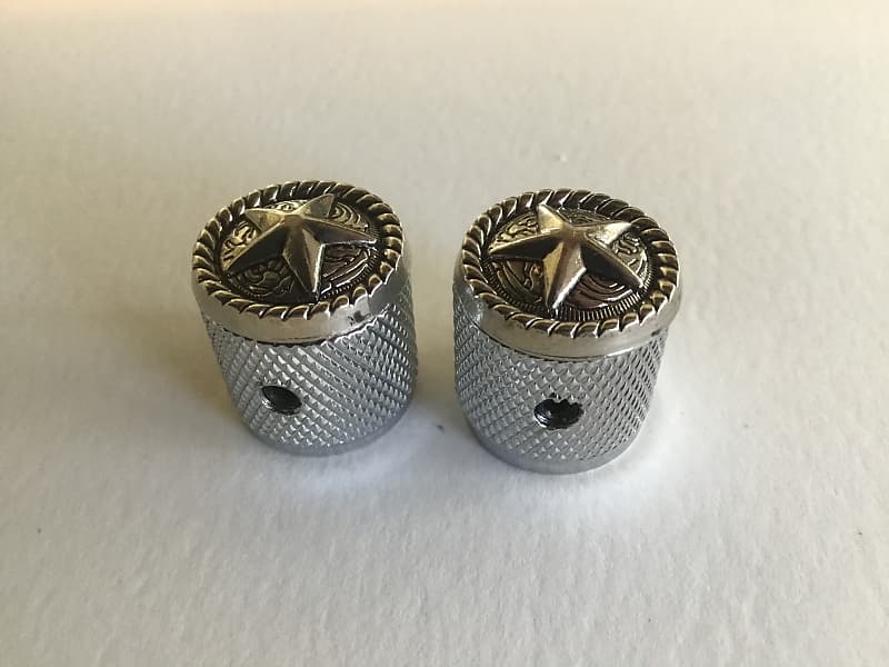Two star guitar knobs with knurled sides. Reverb