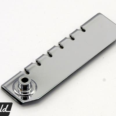 The original adapter bracket to swap Rickenbacker R tailpiece for