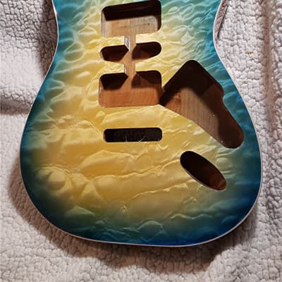 Stunning USA made,Double bound Alder body in Coral reef blue with 5A quilt maple top.Made for a Strat body# CRBS-1. Free pick guard while supplies last. image 1