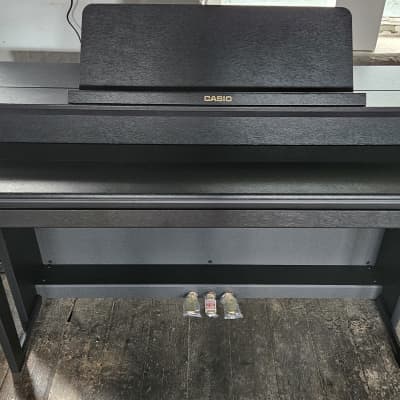 Casio GP-310 Celviano Grand Hybrid Digital Piano in Black.