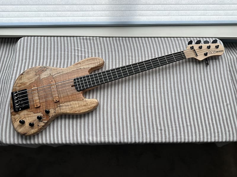 MG Bass MGBASS JB1 SPALTED MAPLE 5-string bass, Made in USA, SPALTED MAPLE top, ASH body, 3-piece MAPLE neck, EBONY fretboard, BARTOLINI pickups and preamp, Italia Leather Straps 4” wide Acorn Amber strap, GATOR hardshell case image 1