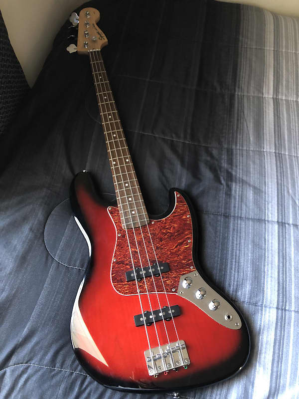 Squier Jazz Bass Standard Trans Red Burst | Reverb