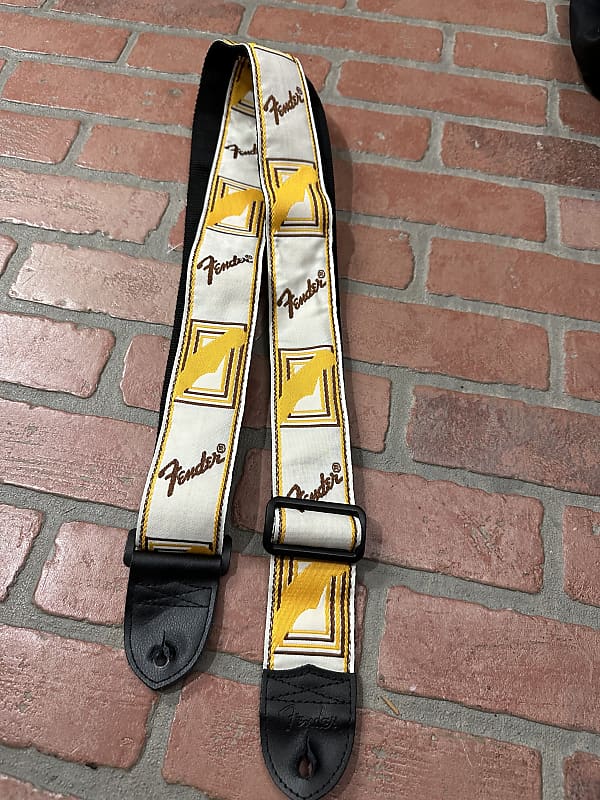 Fender monogram guitar strap, yellow on white