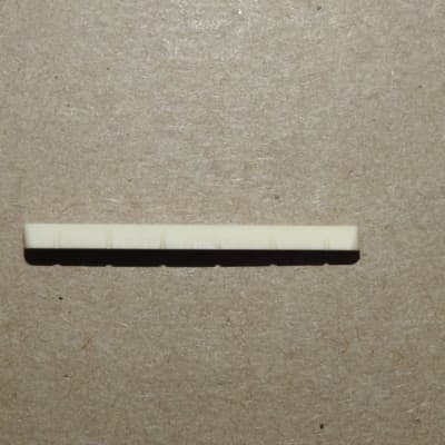 Allparts BN-0251-000 Bleached And Slotted Flat Bottom Nut for Fender Style Guitars 1 11/16" Long image 2