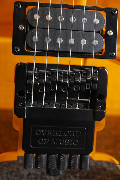 Headless 6 string guitar, Orange Lucite, Overlord of Music Headless 6 string guitar, Orange Lucite, Overlord of Music