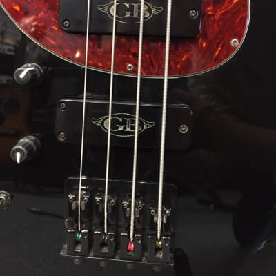 GB Bernie Goodfellow Spitfire Boutique Bass guitar in black, with tortoise shell scratch plate image 6