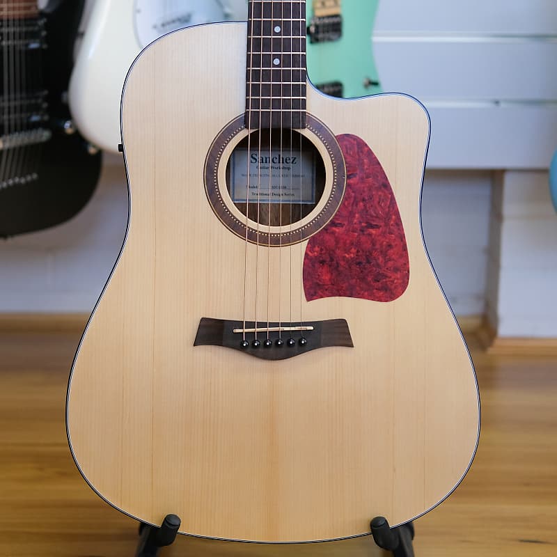 Sanchez deals acoustic guitar