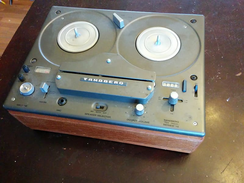 Practical Tandberg reel to reel tape recorder with wood cheeks