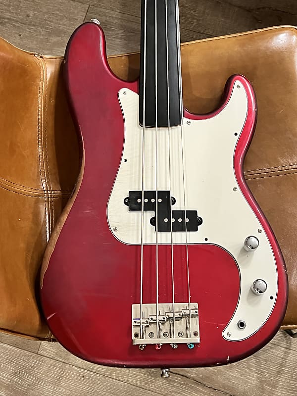 Squier Precision Bass Fretless (unlined) Red Heavy Relic | Reverb