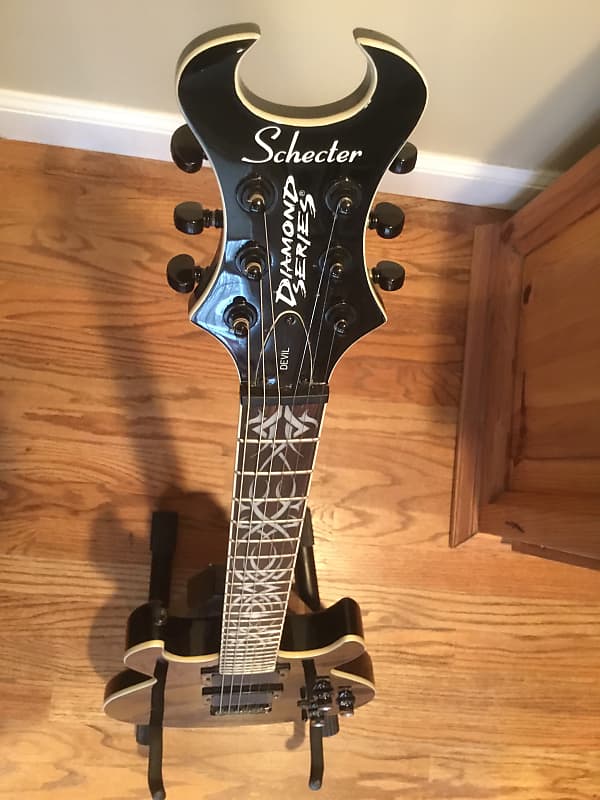 Schecter S1 Devil Diamond series with tribal inlays and soft