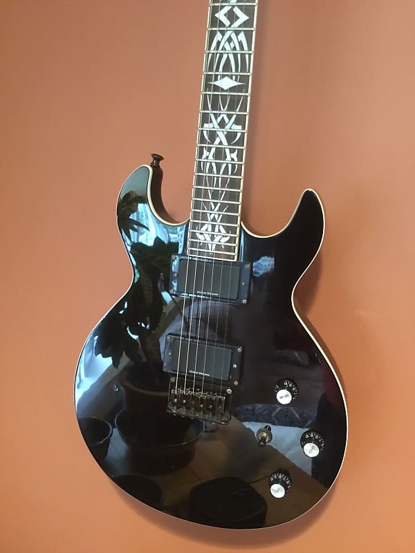 Schecter S1 Devil Diamond series with tribal inlays and soft