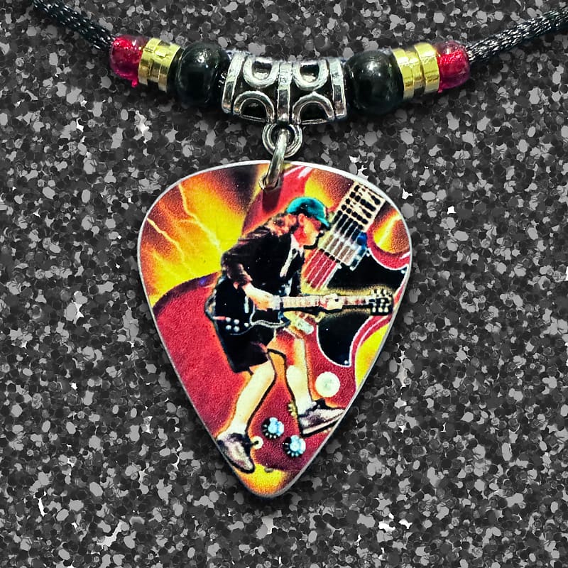 Handmade Angus Young AC/DC tribute aluminum guitar pick | Reverb