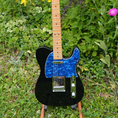 A very sharp Fender Standard Telecaster in Black w/New Blue pickguard, New Dunlop Straploks, New HSC, plus New Set up. image 4