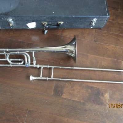Trigger trombone with case and mouthpiece.  Silver image 1