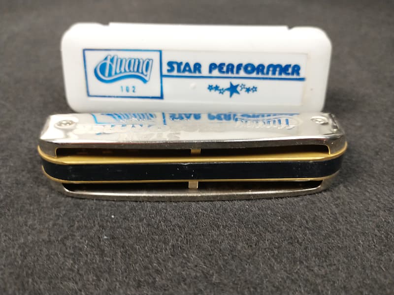 Huang star deals performer harmonica