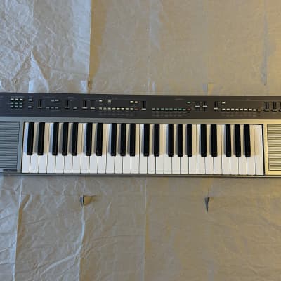 Yamaha  PS-55 Portatone early 80s 1983 49key keyboard Stereo Speakers Chorus&Symphonic effects Piano PCM FM Synth 80s Pop MINT Condition in Original box with Cover and Users Manual