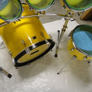 North drum set in yellow with 6'',8''10'' toms a 14'' floor tom and a 22'' bass drum with rack image 3