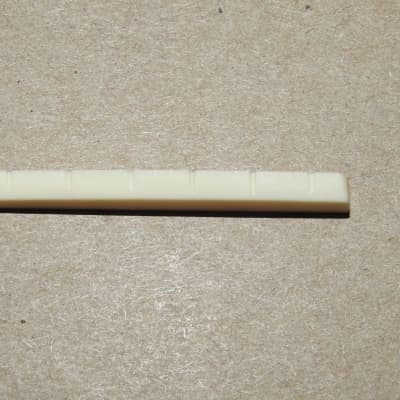 Allparts BN-0251-000 Bleached And Slotted Flat Bottom Nut for Fender Style Guitars 1 11/16" Long image 5