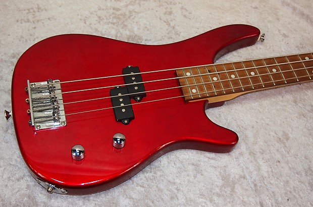 Rogue 4 string electric bass guitar in red finish