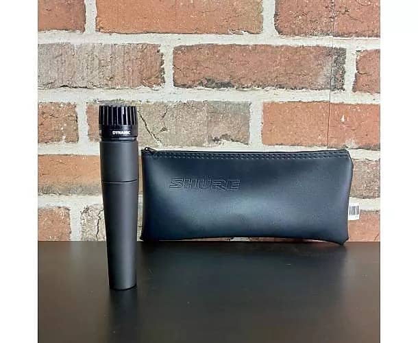 SHURE - SM57 + HOUSSE + PINCE  			