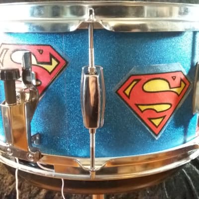 Pearl Export  custom Assaulted Battery two color Superman themed graphics over a blue sparkle wrap. image 1