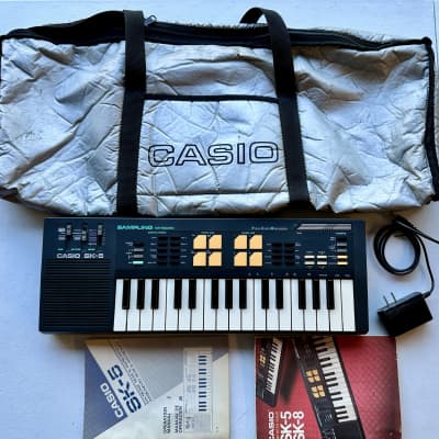 Casio SK-5 32-Key Sampling Keyboard 1980s w/ Power Supply + Bag + Manual + Songbook + Stickers