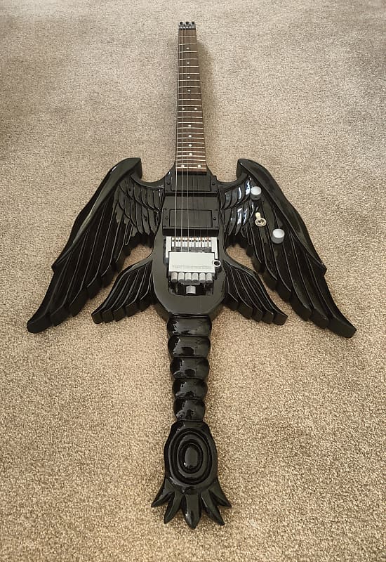 Winged headless guitar. | Reverb UK