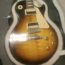 Gibson Les Paul 
Tobacco Sunburst. Locking Grover Machine Heads, Active Pickups , Push Pull For Both Pickups. And An Active Boost Coil Tap Push Pull