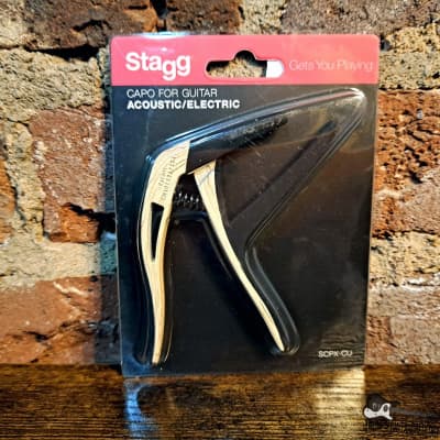 Stagg Curved Trigger Capo - Clear Wood for sale
