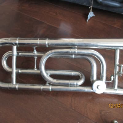 Trigger trombone with case and mouthpiece.  Silver image 7