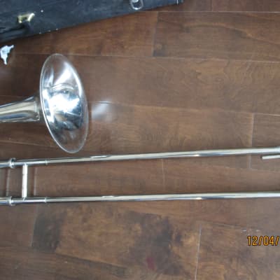 Trigger trombone with case and mouthpiece.  Silver image 3