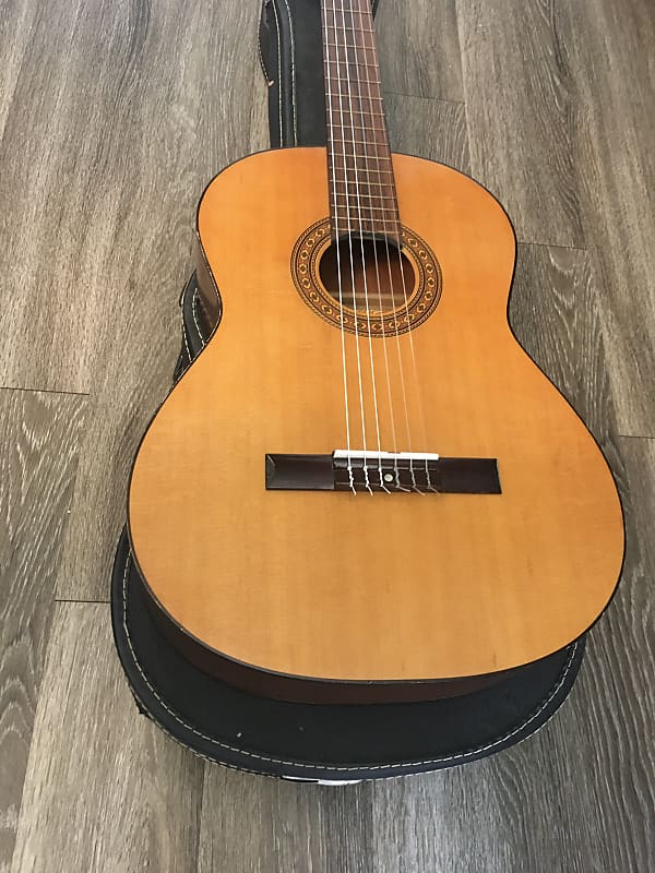 Estrella deals classical guitar