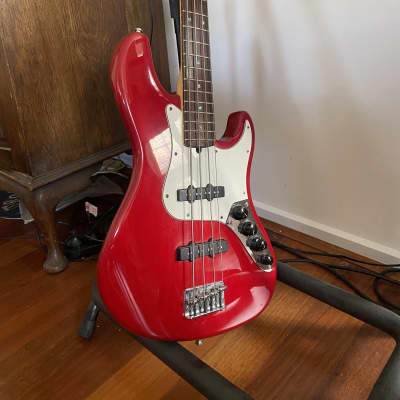Fender American Deluxe Jazz Bass with Rosewood Fretboard 1999 Crimson Red Transparent image 4
